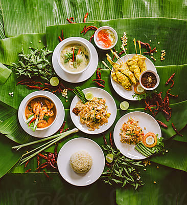 traditional thai food served on a banana leaf